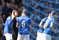 Everton defender John Stones (left) celebrates with teammates after scoring against Manchester United at Goodison Park on April 26, 2015