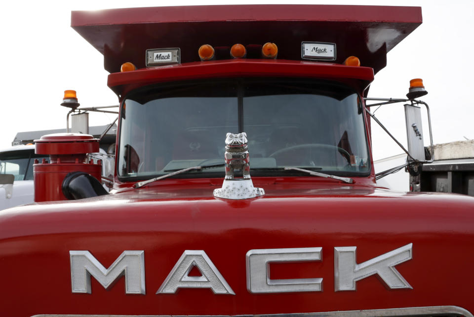 File - A hood ornament is seen on a used Mack truck on a lot in Evans City, Pa., Jan. 9, 2020. Union workers at Mack Trucks have voted down a tentative five-year contract agreement reached with the company. (AP Photo/Keith Srakocic, File)