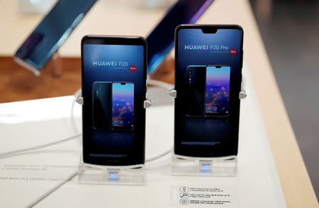 Mobile phones are seen at Huawei store in Madrid, Spain February 7, 2019. REUTERS/Juan Medina