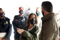 Democratic vice presidential candidate Sen. Kamala Harris, D-Calif., and California Gov. Gavin Newsom discuss the damage during the Creek Fire at Pine Ridge Elementary, Tuesday, Sept. 15, 2020 in Auberry, Calif. (AP Photo/Gary Kazanjian)