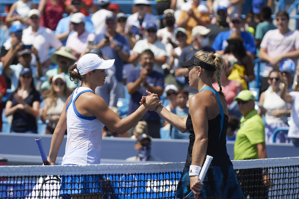 Angelique Kerber (pictured right) shakes hands with Ash Barty (pictured left) at the Southern & Western Open.