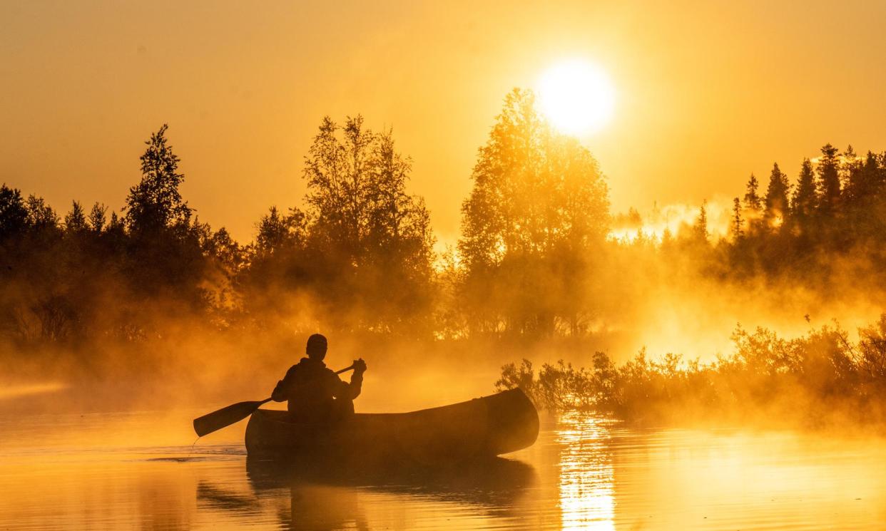 <span>Canoeing under the midnight sun in Finnish Lapland with Slow Adventure.</span><span>Photograph: ©Metsä Kolo</span>