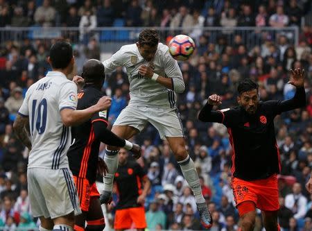 Football Soccer- Spanish La Liga Santander - Real Madrid v Valencia- Santiago Bernabeu Stadium, Madrid, Spain - 29/04/17 - Real Madrid's Cristiano Ronaldo scores. REUTERS/Susana Vera