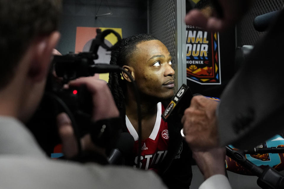 NC State guard DJ Horne speaks with reporters ahead of a Final Four college basketball game in the NCAA Tournament, Thursday, April 4, 2024, in Glendale, Ariz. NC State plays Purdue on Saturday. (AP Photo/Brynn Anderson )