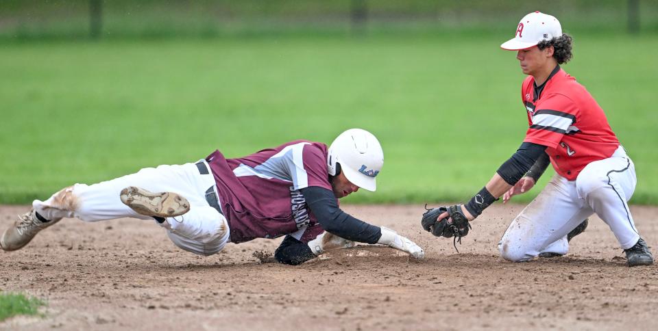 HARWICH 05/30/24  Aidan Choukri of Cape Tech grabs onto second avoiding the tag by Logan Cormier of Athol n the preliminary round of Division 5 baseball
Ron Schloerb/Cape Cod Times