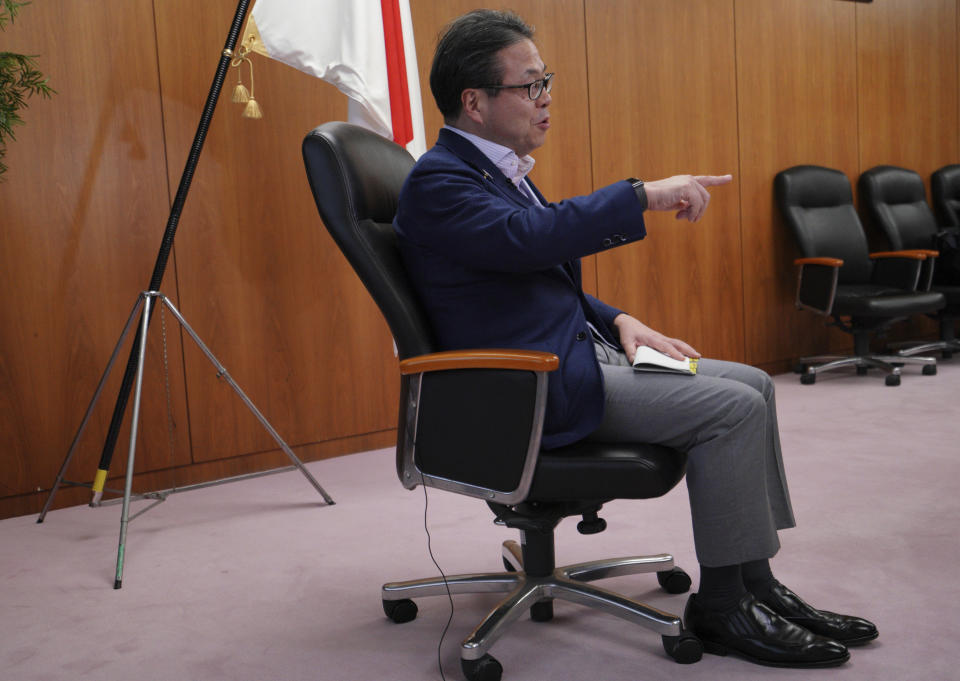 Japan’s Trade Minister Hiroshige Seko speaks during an exclusive interview with The Associated Press at his office in Tokyo Thursday, Aug. 23, 2018. Seko criticized President Donald Trump’s tariff policies as based on a serious misunderstanding about the importance of free trade and the contributions of Japanese companies to the U.S. economy. (AP Photo/Eugene Hoshiko)
