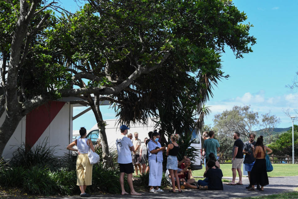 People lining up to be tested at a walk-through Covid testing site at the Surf Life Saving Club in Byron Bay, Australia.