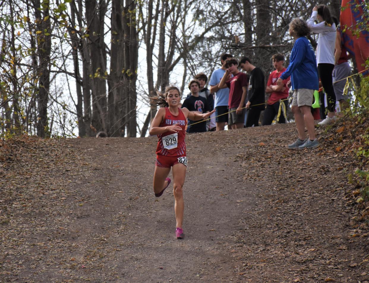 New Hartford Spartan Alexandria French descends a hill late in her race at the Section III's 2022 cross country championship meet. French finiched second that day but returnes and won the 2023 Class B race Saturday at Vernon-Verona-Sherrill High School.