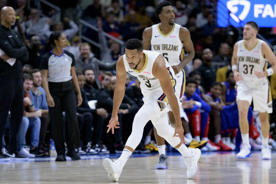 New Orleans Pelicans guard CJ McCollum (3) gestures after making a 3-point basket against the Detroit Pistons during the first half of an NBA basketball game in New Orleans, Thursday, Nov. 2, 2023. (AP Photo/Matthew Hinton)