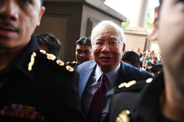 Najib Razak became the first former Malaysian prime minister to appear in court when he arrived to face graft charges related to the disappearance of billions of dollars of state funds during his nine-year rule