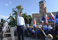 A candidate in Poland's July 12 presidential election runoff, Warsaw Mayor Rafał Trzaskowski with wife Małgorzata celebrate during a rally presidential election runoff, in Częstochowa, Poland, Saturday, July 4, 2020. Surveys give almost equal chances in the vote to Trzaskowski and to incumbent president, Andrzej Duda, who is seeking reelection.(AP Photo/Czarek Sokolowski)