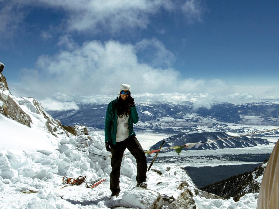 Alka Bhatt on a mountain covered in snow.