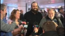 Alexandre Paul smiles along with his parents, Nicole and Raymond, after his arrival in Montreal. Paul was detained by Russian authorities Sept. 19 along with 29 others on board a Greenpeace ship while protesting oil drilling in Russia's Arctic.