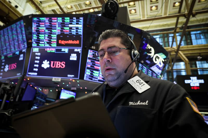 Traders work on the floor of the NYSE in New York