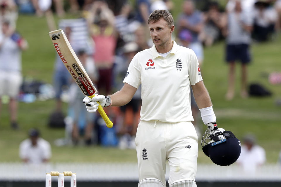 England's Joe Root celebrates after scoring a century during play on day three of the second cricket test between England and New Zealand at Seddon Park in Hamilton, New Zealand, Sunday, Dec. 1, 2019. (AP Photo/Mark Baker)
