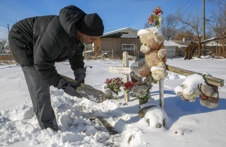 In this Jan. 21, 2019 photo, Marvin Clinton maintains a makeshift memorial honoring his fiancee, murder victim Teaira Batey, near where her body was found in Gary, Ind. Five abandoned homes where former Marine Darren Vann strangled and hid the bodies of seven women will be demolished and replaced by memorials to the victims. Vann was arrested in 2014 and pleaded guilty last year to killing Batey, 28; Afrikka Hardy, 19; Anith Jones, 35; Tracy Martin, 41; Kristine Williams, 36; Sonya Billingsley, 53; and Tanya Gatlin, 27. (John J. Watkins/The Times via AP)