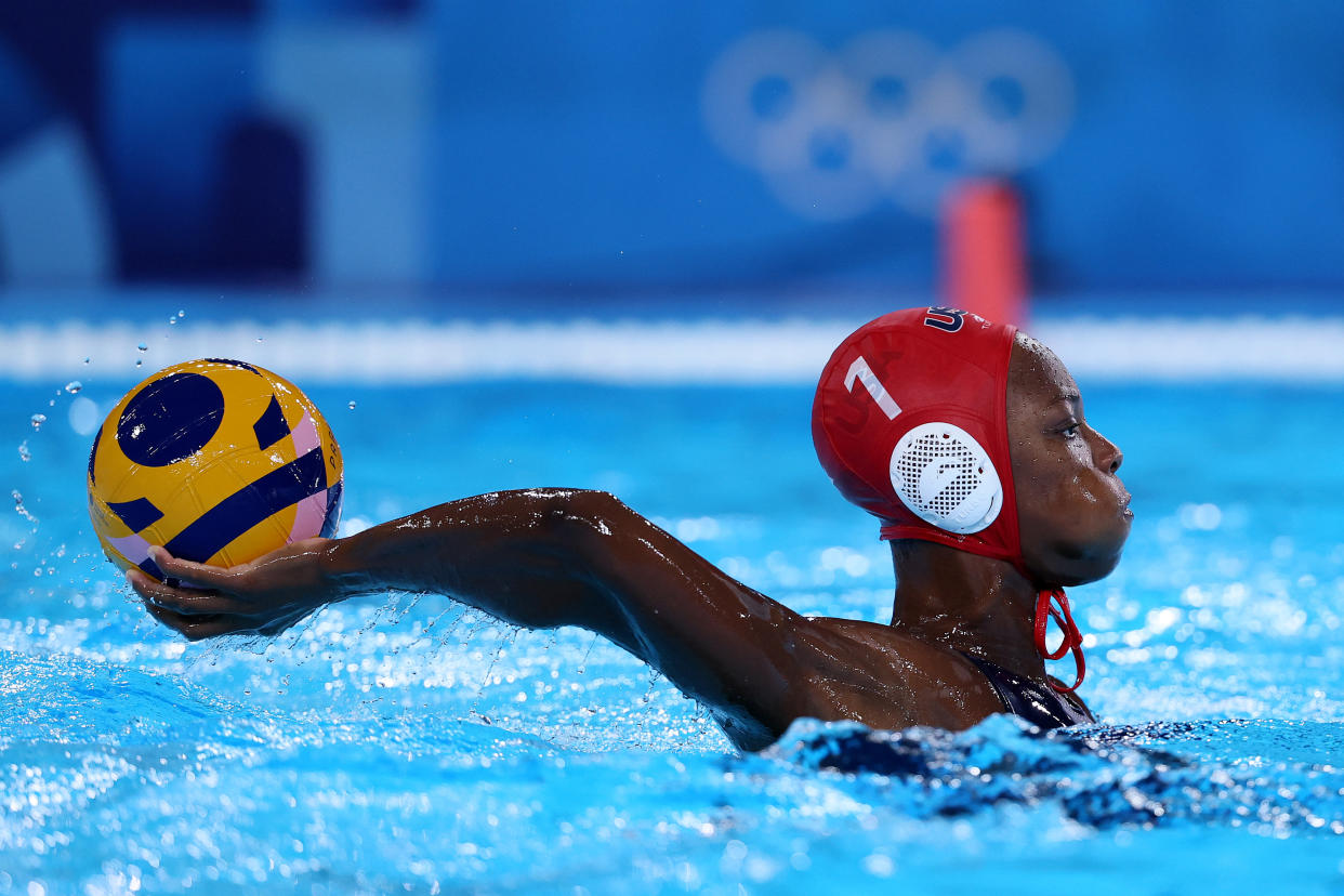 Wowed by Team USA water polo player Ashleigh Johnson? Here's what her training entails — and how we mere mortals can exercise like Olympians, too. (Clive Rose/Getty Images)