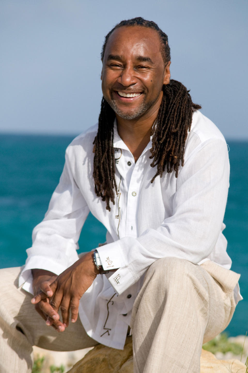 This undated image released by Joseph Jones shows author Eric Jerome Dickey in Antigua. Dickey, the bestselling novelist who blended crime, romance and eroticism in “Sister, Sister,” “Waking With Enemies” and dozens of other stories about contemporary Black life, has died at age 59. Dickey's publicist at Penguin Random House, Emily Canders, told The Associated Press that the author died Sunday, Jan. 3, 2021 in Los Angeles after a long illness. (Joseph Jones via AP)