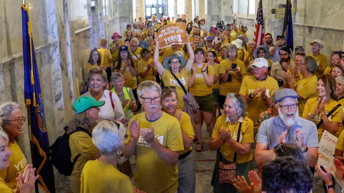 Idahoans for Open Primaries volunteers begin chanting, “Let us vote,” after delivering the final box of signatures to the Idaho Secretary of State’s Office at the Capitol on Tuesday. They said they gathered 97,000 signatures for an initiative to implement open primaries.