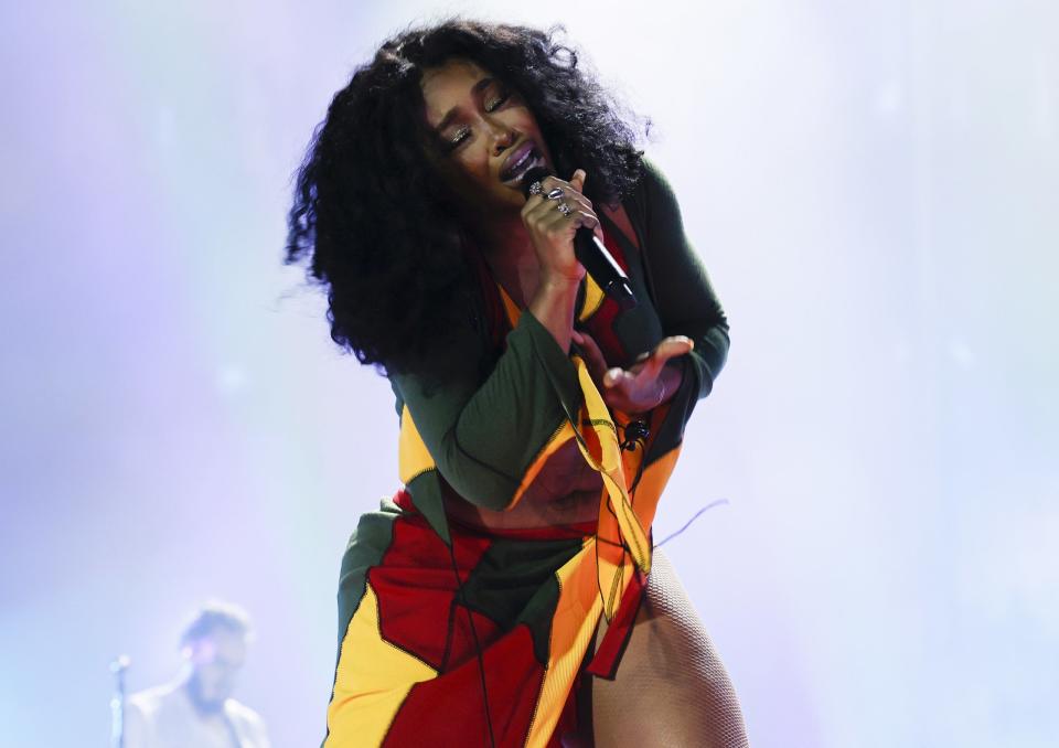 A close-up of SZA performing