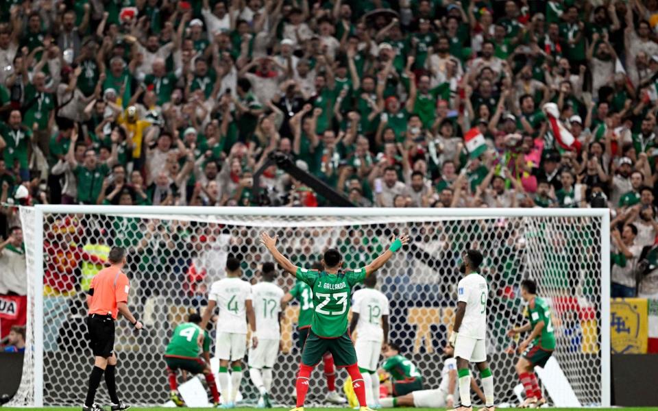 Jesus Gallardo (C) celebrates after Mexico's forward #20 Henry Martin scored their team's first goal during the Qatar 2022 World Cup Group C football match between Saudi Arabia and Mexico at the Lusail Stadium - Patricia de Melo Moreira/Getty Images