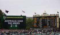 A general view of a board showing the series results and the score board after England lost the second Ashes cricket test against Australia at the Adelaide Oval December 9, 2013. Australia captured England's four remaining wickets before lunch to close out an emphatic 218-run victory in the second Ashes test on Monday. REUTERS/David Gray (AUSTRALIA - Tags: SPORT CRICKET)