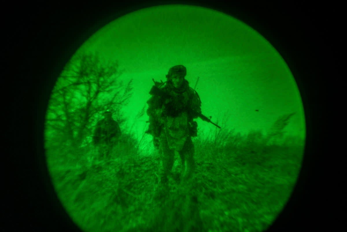 Ukrainian servicemen of the 3rd Assault brigade are seen through night vision goggles, or NVG, during a night mission on the frontline near Avdiivka last month (AP)