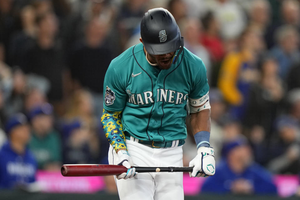 Seattle Mariners' Julio Rodríguez reacts as he flies out against the Texas Rangers during the fifth inning of a baseball game, Saturday, Sept. 30, 2023, in Seattle. (AP Photo/Lindsey Wasson)