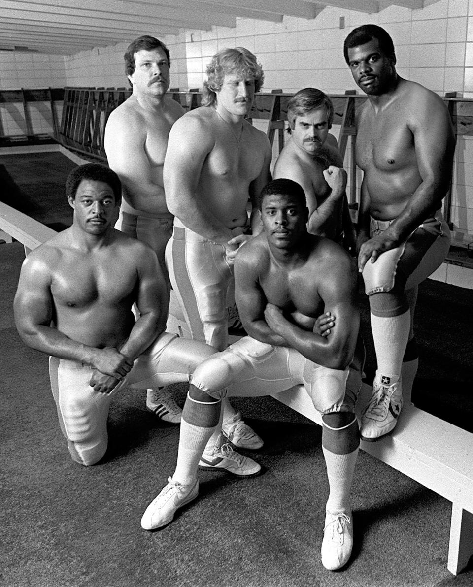 February 19, 1984 - These five players represent part of the Memphis Showboats' muscle, which will be put to the test for the first time on February 26 against Philadlephia at Liberty Bowl Memorial Stadium. From Left are: offensive guard Mike Horton (6-3, 275), offensive tackle Greg Fairchild (605, 270), defensive end Brett Williams (6-3, 260), defensive end Reggie White (6-6, 284) and offensive tackle Phil McKinnely (6-6,270). Oh, and the little guy between Williams and Mckennely is Rudi Schiffer, Showboats publicist, who was clowing with the guys. (Bill Kelley III / The Commercial Appeal)