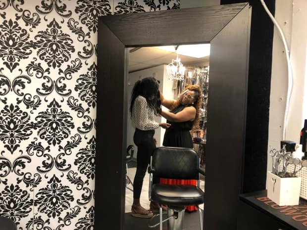 Amani Hair Studio owner Michele Bonnick offers workshops specializing in Black and textured hair to fill the gap left by the lack of training mandated by the Ontario College of Trades. (Angelina King/CBC - image credit)
