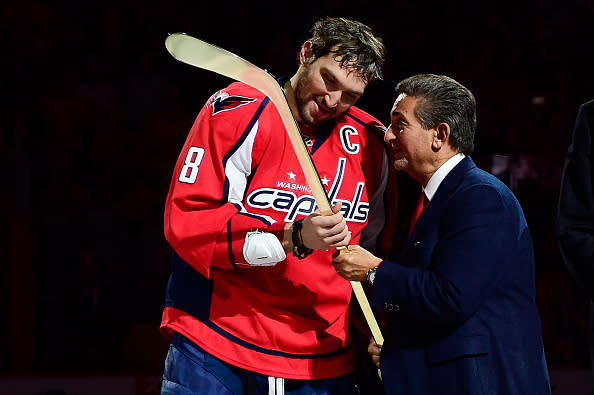 WASHINGTON, DC - JANUARY 14: Washington Capitals owner Ted Leonsis presents Alex Ovechkin #8 of the Washington Capitals a commemorative gold hockey stick in honor of his 500th career NHL goal during a ceremony prior to thier NHL game against the Vancouver Canucks at Verizon Center on January 14, 2016 in Washington, DC. (Photo by Patrick McDermott/NHLI via Getty Images)