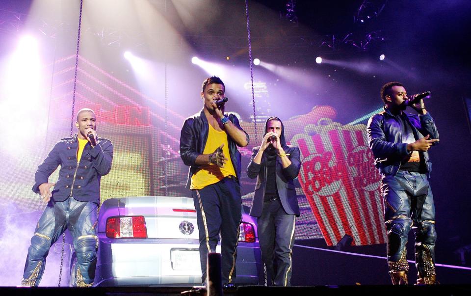 JB Jonathan Gill,Aston Merrygold,Marvin Humes,Oritse Williams of jLS perform on stage at the 02 Arena, London.