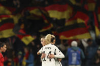 Germany's Jule Brand and Lena Lattwein, right, hug each other at the end of the Women's World Cup Group H soccer match between Germany and Morocco in Melbourne, Australia, Monday, July 24, 2023. Germany won 6-0. (AP Photo/Victoria Adkins)