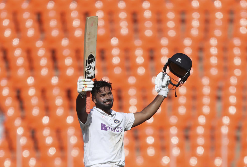 India's Rishabh Pant celebrates scoring a century during the second day of fourth cricket test match between India and England at Narendra Modi Stadium in Ahmedabad, India, Friday, March 5, 2021. (AP Photo/Aijaz Rahi)