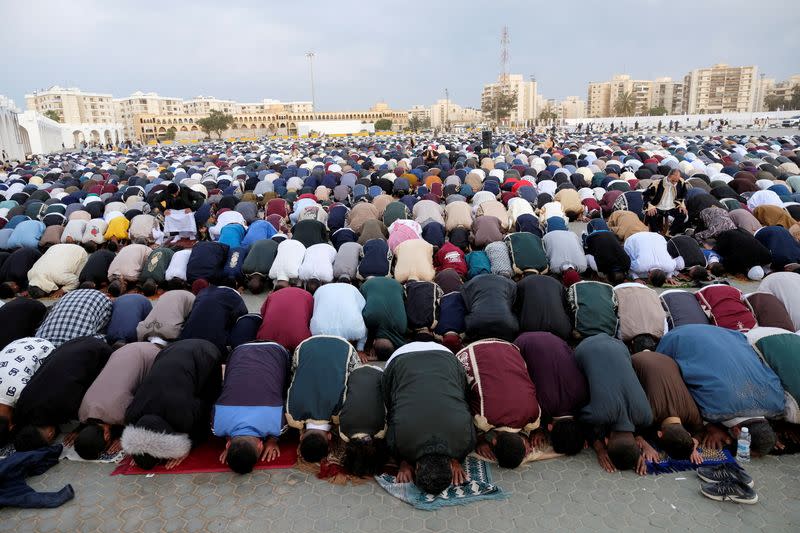 People attend an Eid al-Fitr prayer, in Benghazi