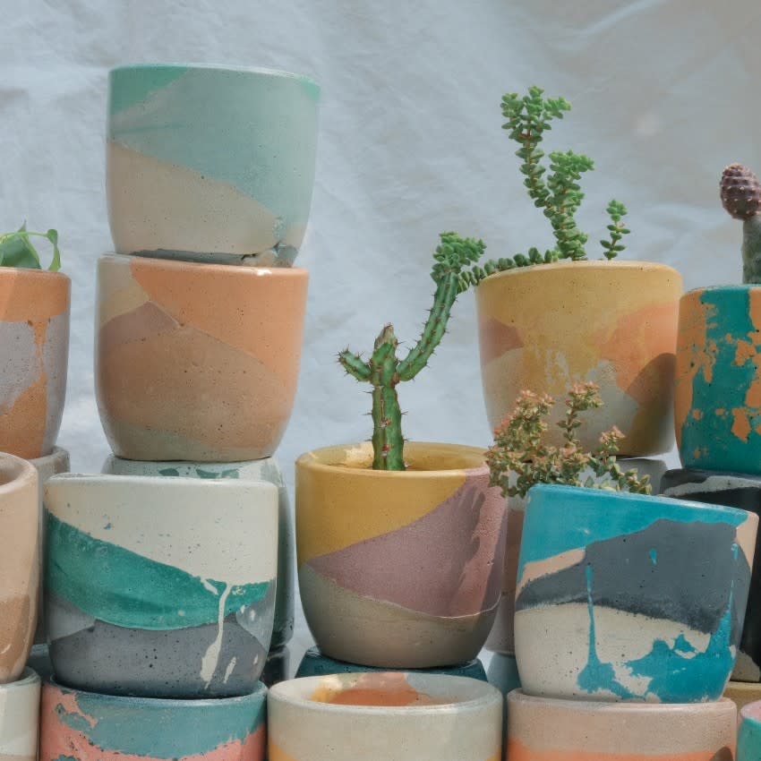 Krizia Flores designs colorful concrete planters and votives in a variety of sizes