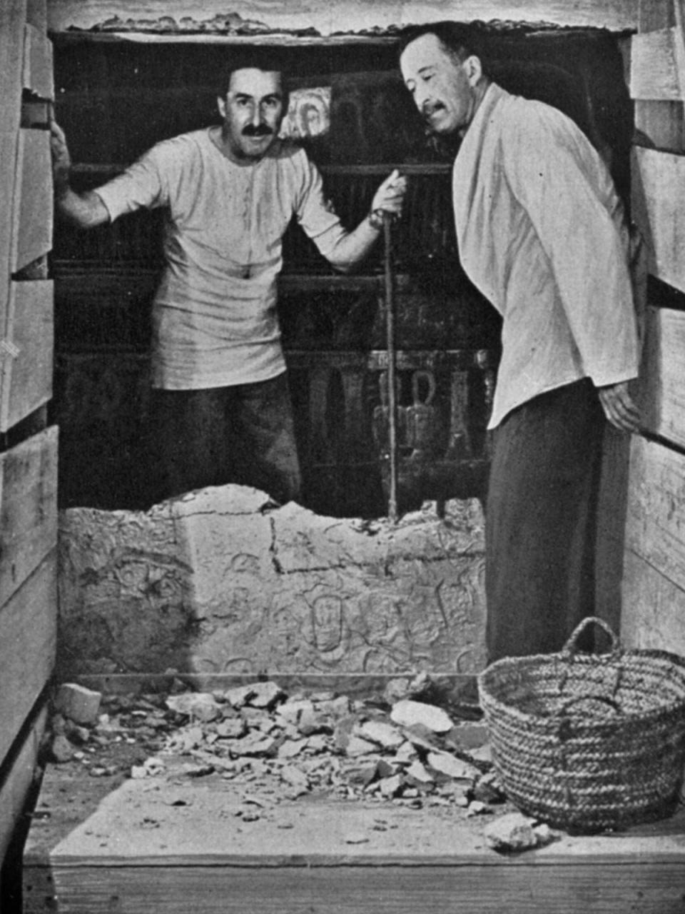 Howard Carter (left) and Lord Carnarvon breaking into King Tutankhamun's tomb, 1923.