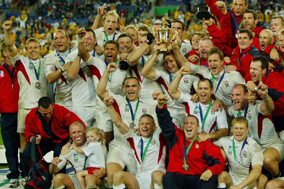 The greatest day: England's team poses with the Webb Ellis Cup in Sydney, 20 years ago today (Picture: ODD ANDERSEN/AFP via Getty Images)