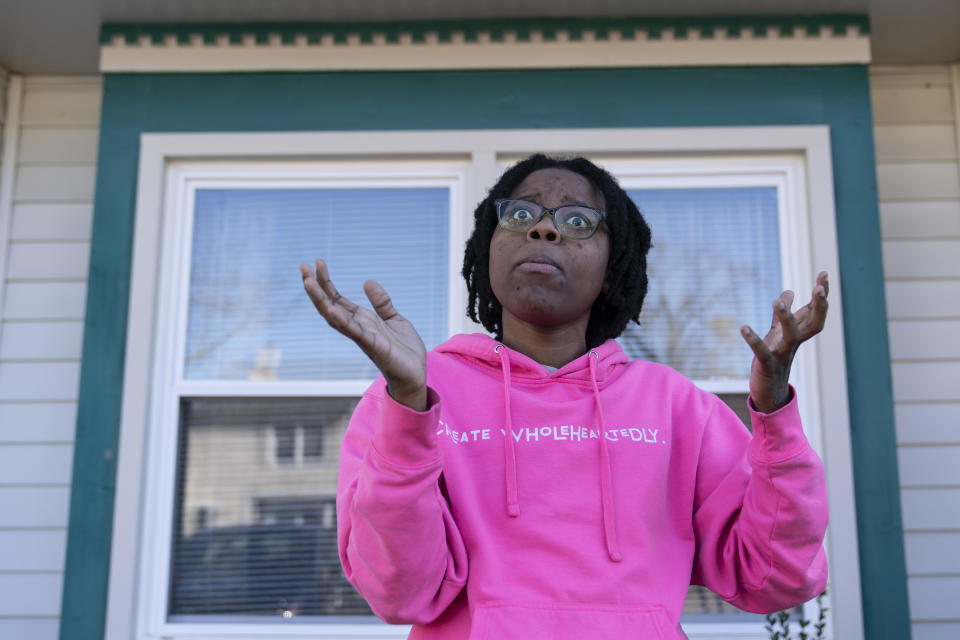 Briana Tyler speaks with The Associated Press about witnessing the mass shooting at a Walmart, Wednesday, Nov. 23, 2022, in Chesapeake, Va. Tyler said the overnight stocking team of about 15 or 20 people had just gotten together in the break room to go over the morning plan. As soon as the team was set to start, she said she looked up, and her manager turned around and opened fire on the staff. (AP Photo/Alex Brandon)