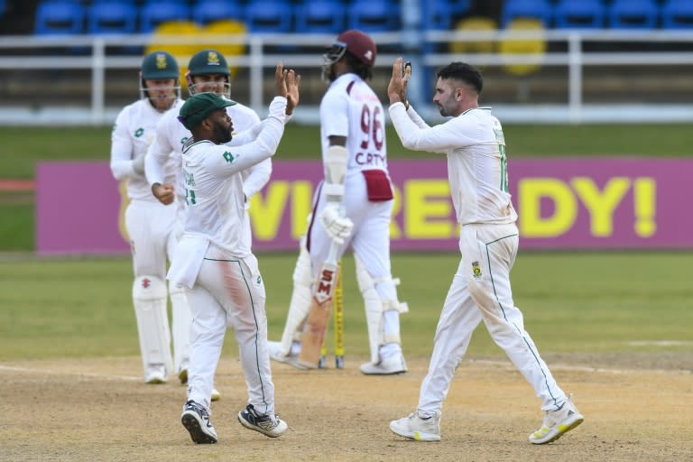 Keshav Maharaj (R) celebrates the dismissal of Keacy Carty (C) during day three of the first Test match between West Indies and South Africa (Randy Brooks)