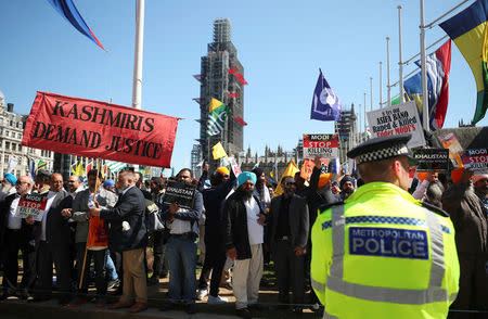 Demonstrators stage a protest against the visit by India's Prime Minister Narendra Modi in Parliament Square, London, Britain, April 18, 2018. REUTERS/Hannah McKay