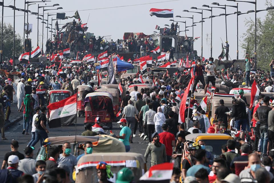 Anti-government protesters gather on the Joumhouriya Bridge leading to the Green Zone, during a demonstration in Baghdad, Iraq, Thursday, Oct. 31, 2019. (AP Photo/Hadi Mizban)