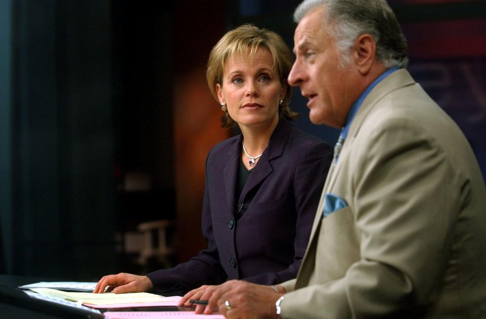 KSL-TV anchors Nadine Wimmer and Dick Nourse, report the news on Sept. 12, 2002. | Michael Brandy, Deseret News