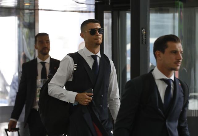 Cristiano Ronaldo spotted looking glum at Moscow airport as he