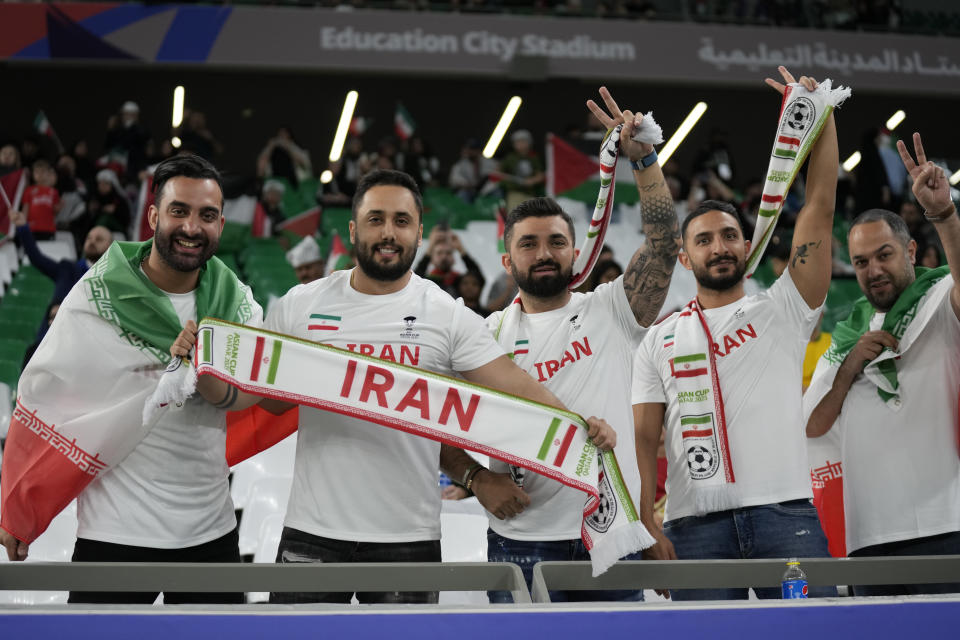 Supporters of Iran pose ahead of the Asian Cup Group C soccer match between Iran and Palestine at the Education City Stadium in Al Rayyan, Qatar, Sunday, Jan. 14, 2024. (AP Photo/Aijaz Rahi)