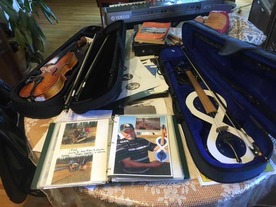 Angus Beaulieu's violin collection includes antiques and some he made himself, like the one shaped in the Métis flag. 