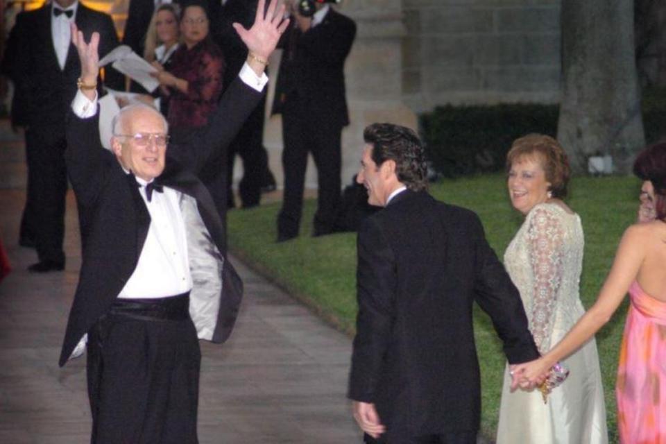 George H. Ross greets the media and spectators at the Donald Trump-Melania Knauss wedding on Jan. 25, 2005, in Palm Beach, Florida. Ross, featured on "The Apprentice," is executive VP for the Trump Organization. (Jeffrey Langlois/Palm Beach Daily News)