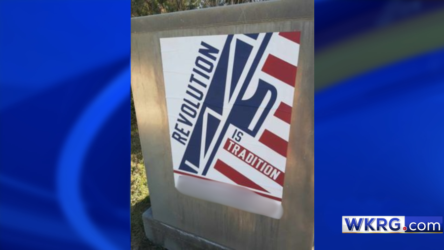 This is a white nationalist ‘Revolution Is Tradition’ sign illegally posted in Spanish Fort. News 5 blurred out the group’s website address. (Photo courtesy of Joseph Redna)