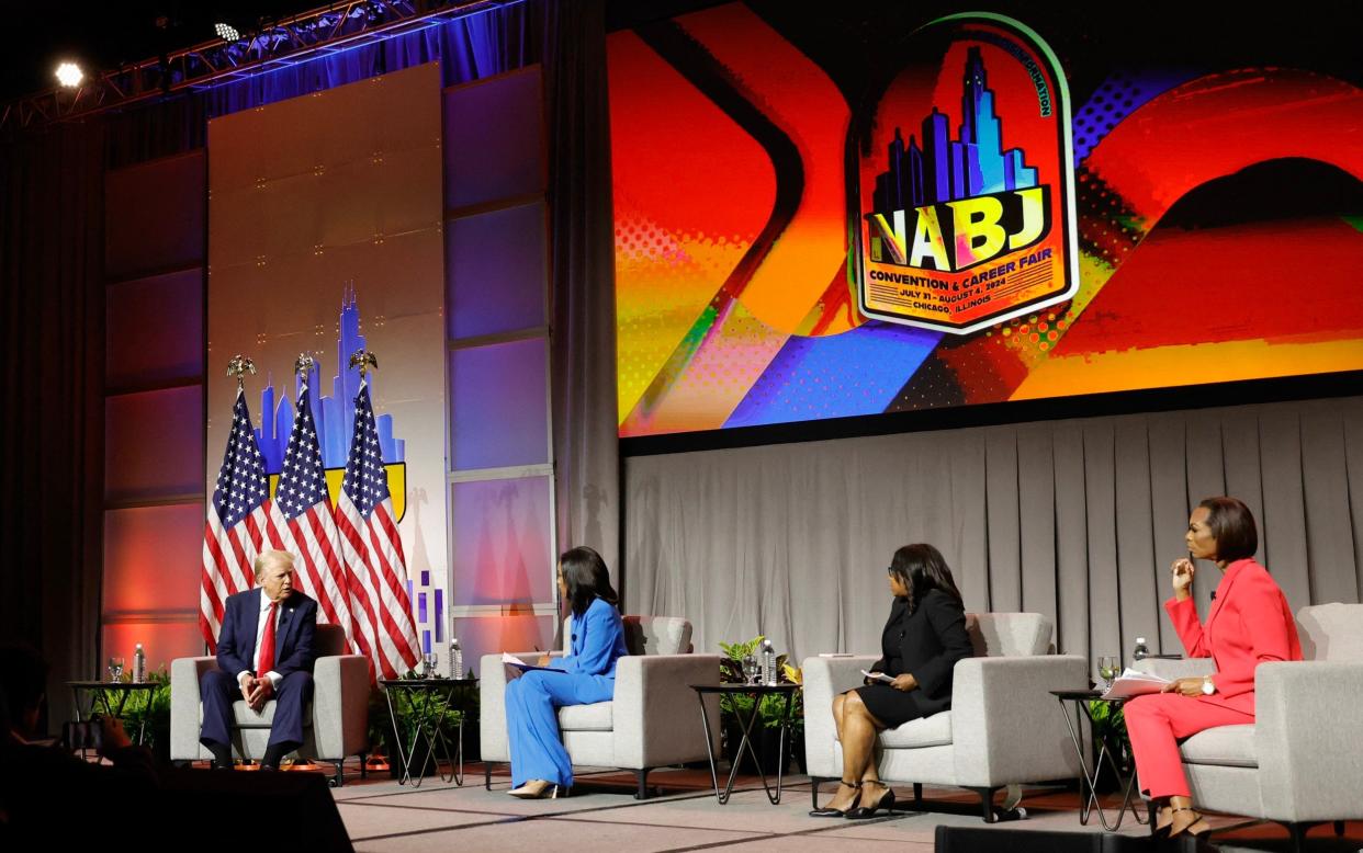 Donald Trump answers questions during the National Association of Black Journalists' annual convention