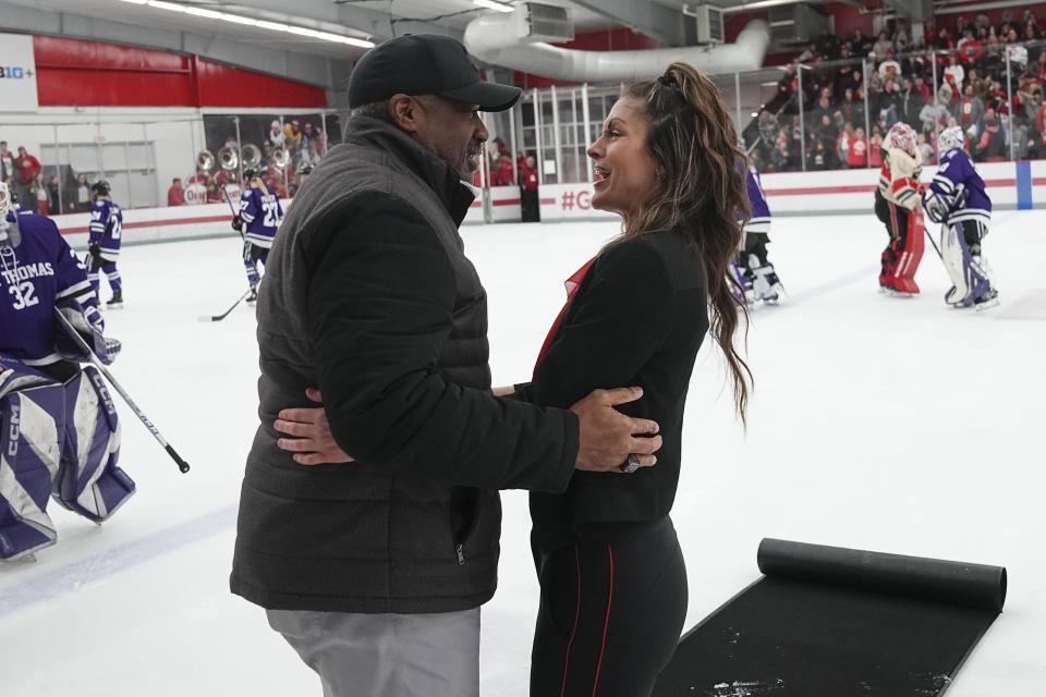 Ohio State women's hockey coach Nadine Muzerall gets hug from athletic director Gene Smith following a win over St. Thomas on Feb. 17.